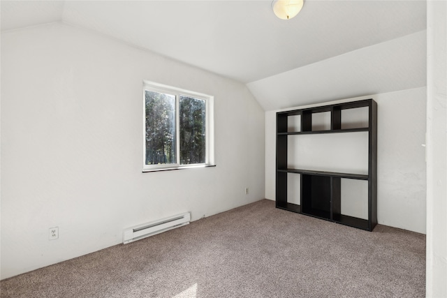 unfurnished bedroom with a baseboard radiator, carpet, and vaulted ceiling