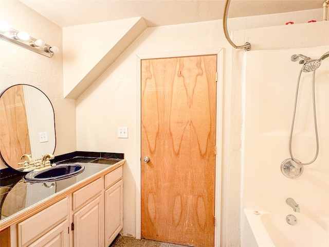 bathroom featuring bathtub / shower combination and vanity