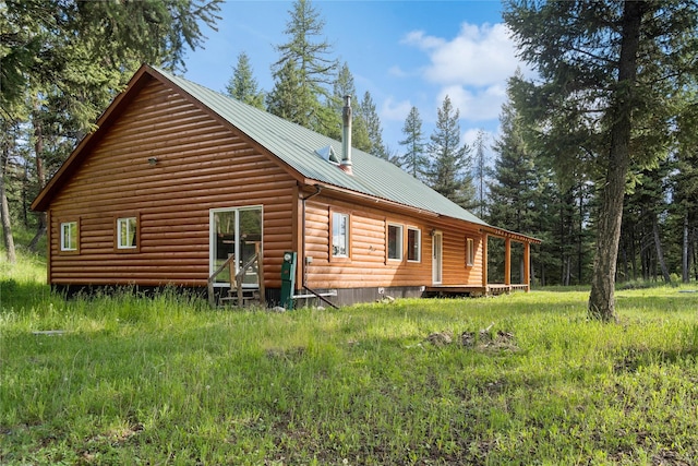 8100 US Highway 2 W, Marion, MT 59925 - view of home's exterior with a metal roof and faux log siding