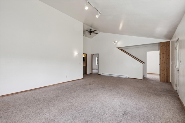 8100 US Highway 2 W, Marion, MT 59925 - unfurnished living room featuring a baseboard radiator, carpet, vaulted ceiling, rail lighting, and ceiling fan