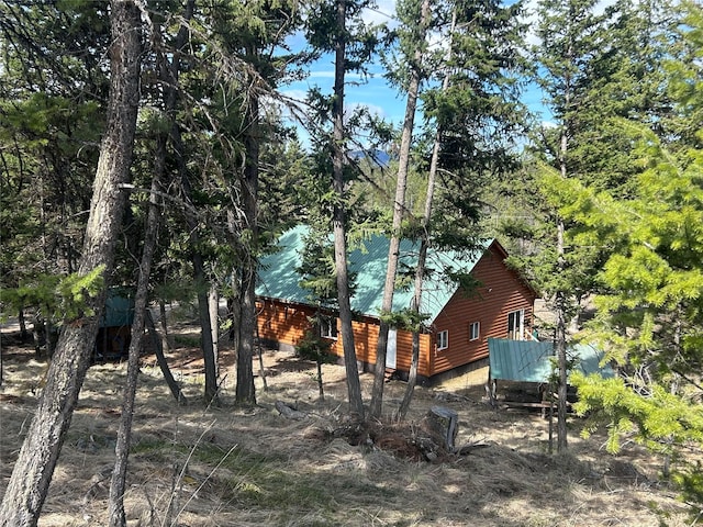8100 US Highway 2 W, Marion, MT 59925 - view of side of home featuring log veneer siding