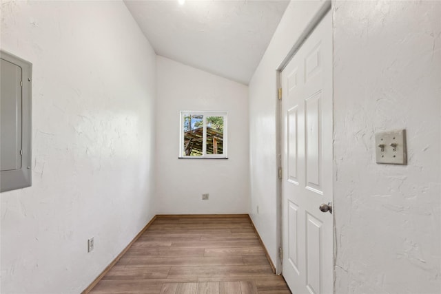 8100 US Highway 2 W, Marion, MT 59925 - unfurnished bedroom with wood finished floors, lofted ceiling, and electric panel