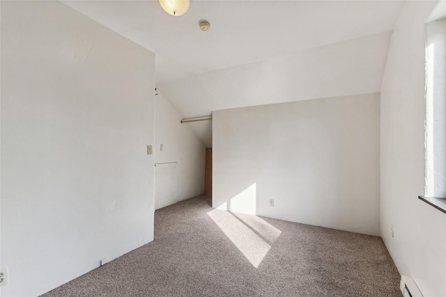 8100 US Highway 2 W, Marion, MT 59925 - empty room with carpet, a baseboard heating unit, a smoke detector, and vaulted ceiling