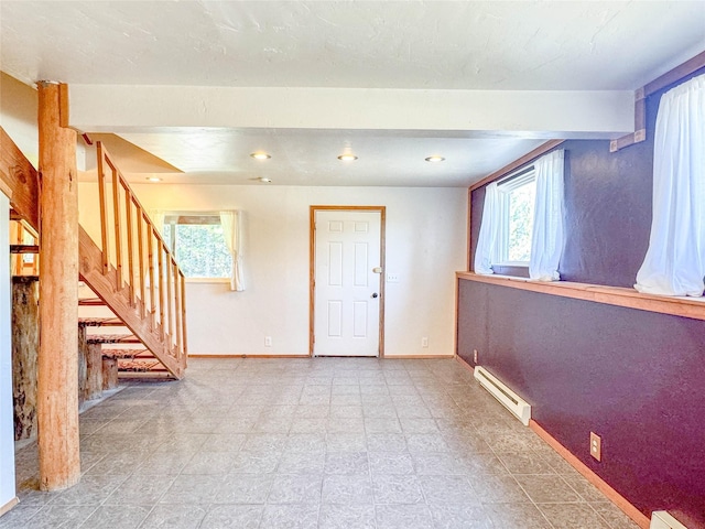 8100 US Highway 2 W, Marion, MT 59925 - below grade area with baseboard heating, healthy amount of natural light, stairway, and recessed lighting