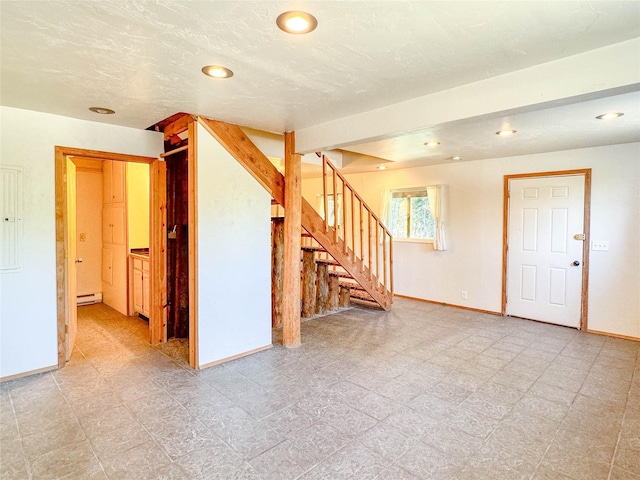 8100 US Highway 2 W, Marion, MT 59925 - empty room featuring stairs, a baseboard radiator, and recessed lighting