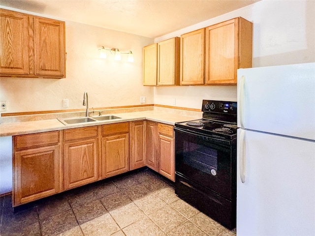 8100 US Highway 2 W, Marion, MT 59925 - kitchen featuring freestanding refrigerator, black range with electric stovetop, and light countertops