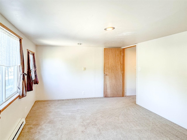 8100 US Highway 2 W, Marion, MT 59925 - carpeted spare room with a baseboard radiator