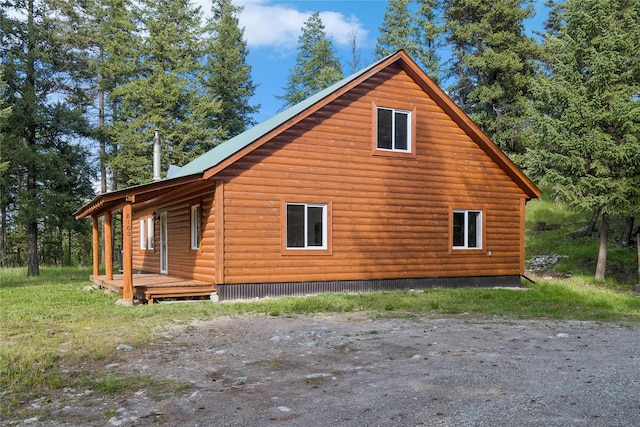 8100 US Highway 2 W, Marion, MT 59925 - view of side of home with a deck
