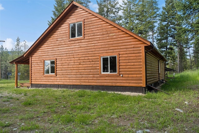 8100 US Highway 2 W, Marion, MT 59925 - view of home's exterior featuring log veneer siding