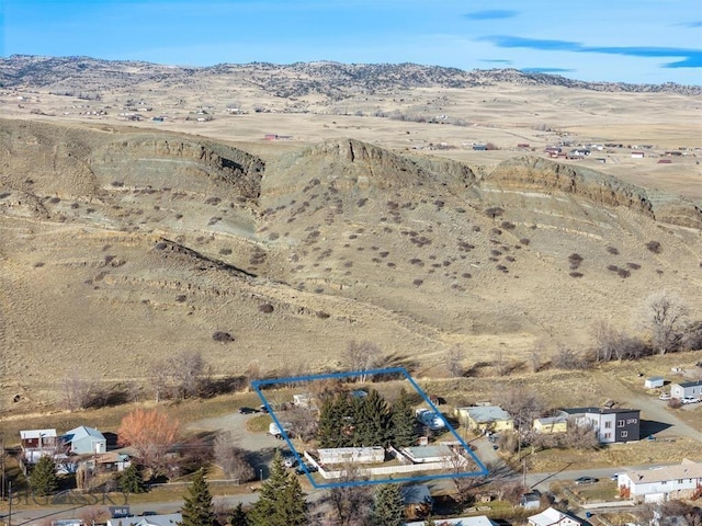 birds eye view of property with a desert view and a mountain view