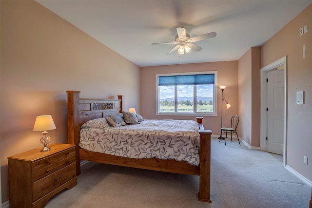 bedroom with ceiling fan and light carpet