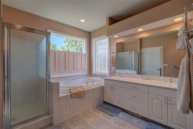 bathroom featuring vanity, tile patterned flooring, and independent shower and bath