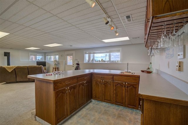 kitchen featuring sink, plenty of natural light, and kitchen peninsula