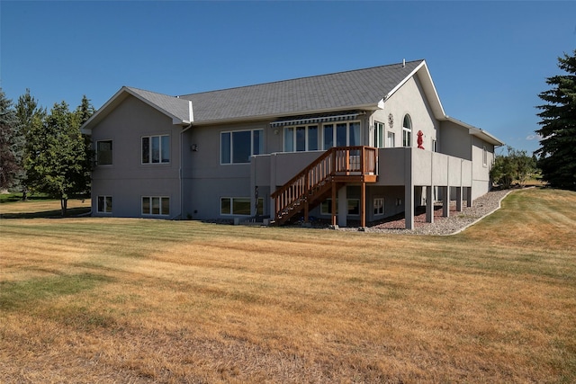 rear view of property with a lawn