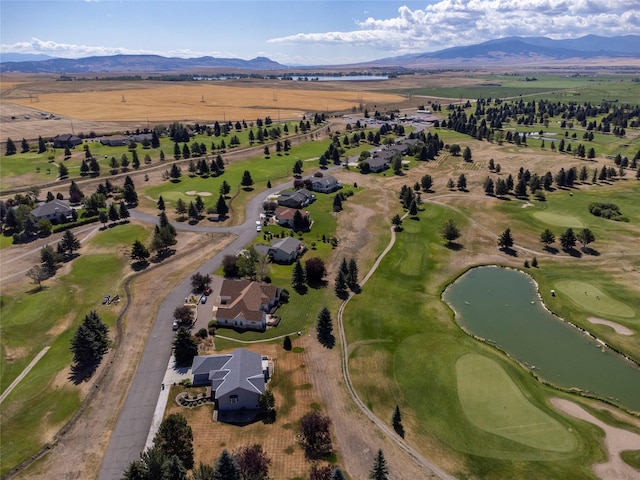 drone / aerial view with a water and mountain view