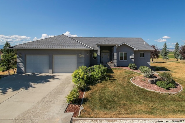 ranch-style house featuring a garage and a front lawn