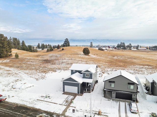 snowy aerial view featuring a rural view