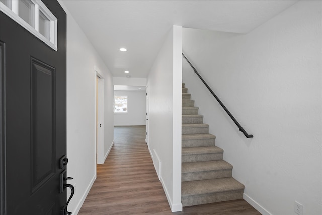 stairway with wood-type flooring