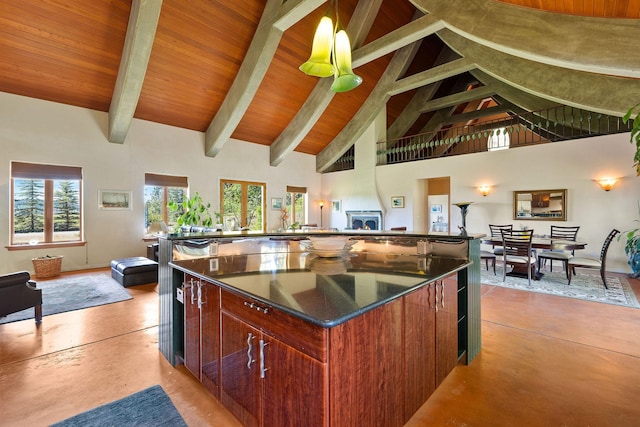 kitchen featuring wood ceiling, a spacious island, hanging light fixtures, high vaulted ceiling, and beamed ceiling