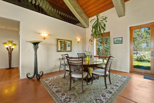 dining space with high vaulted ceiling, wood ceiling, beamed ceiling, and concrete floors