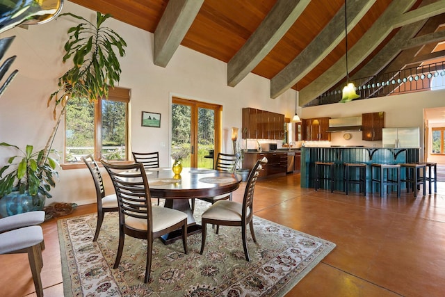 dining area with french doors, beamed ceiling, high vaulted ceiling, wooden ceiling, and concrete flooring