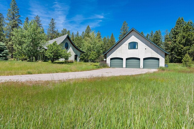 exterior space featuring an outdoor structure and a garage