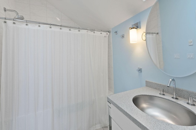 bathroom featuring a shower with curtain and vanity