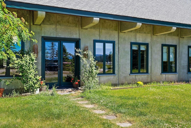 entrance to property with a yard