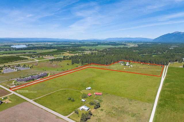 aerial view featuring a rural view and a water and mountain view