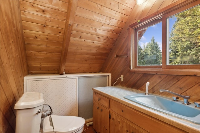 bathroom featuring wood ceiling, vaulted ceiling, wood walls, and toilet