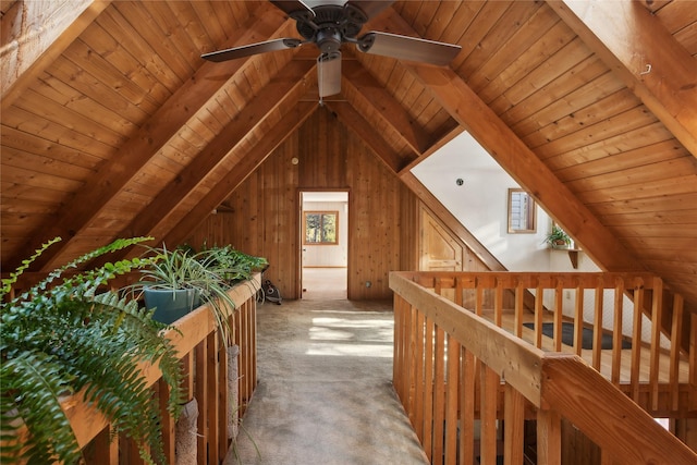 bonus room with vaulted ceiling with beams, wood ceiling, and wooden walls