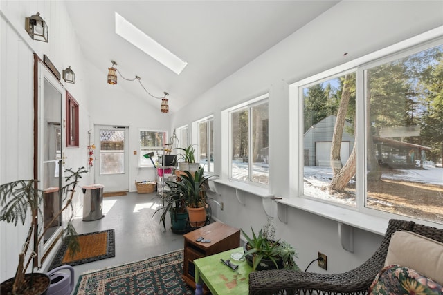 sunroom / solarium with lofted ceiling with skylight