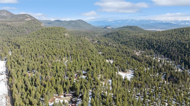 bird's eye view with a wooded view and a mountain view