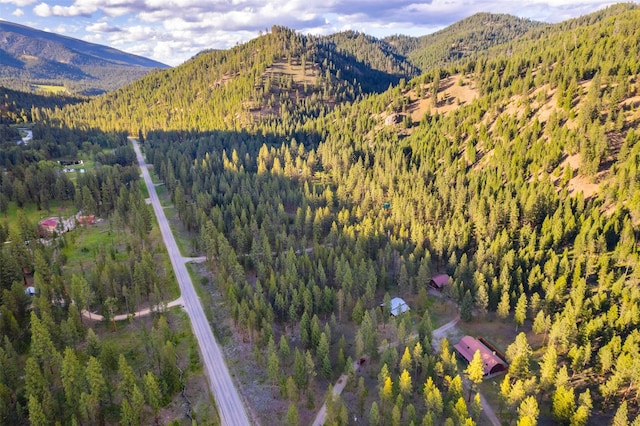 aerial view with a view of trees and a mountain view