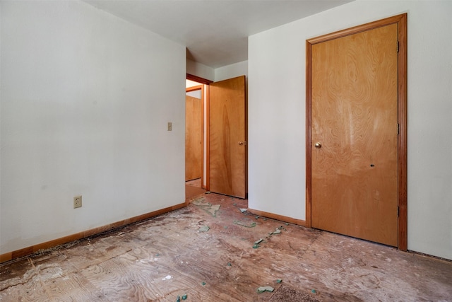 unfurnished bedroom with baseboards