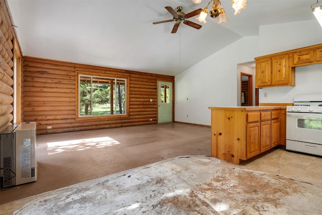 kitchen featuring heating unit, white range with gas stovetop, light countertops, rustic walls, and brown cabinetry