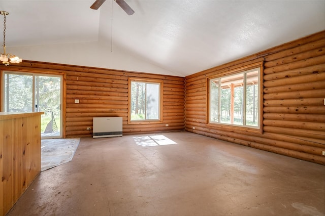 unfurnished living room with log walls, plenty of natural light, and vaulted ceiling