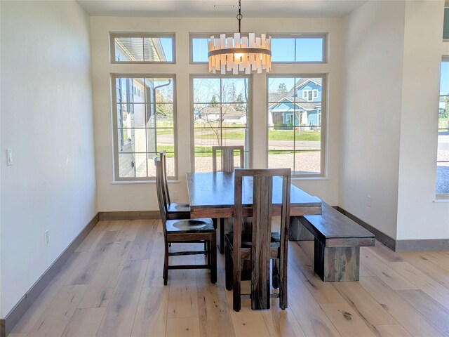 585 Dayton St SE, Ronan, MT 59864 - dining room featuring light wood-type flooring and a chandelier