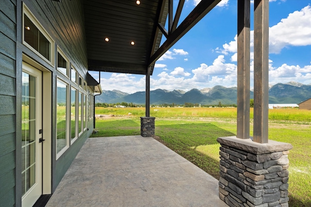 view of patio featuring a mountain view and french doors