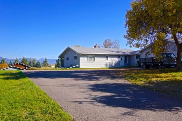 ranch-style house with a front lawn