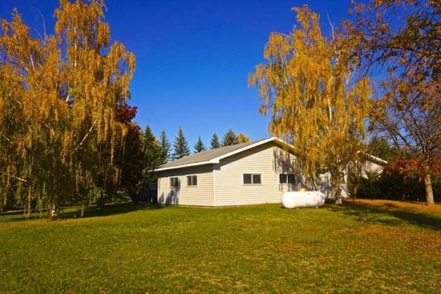 view of property exterior featuring a yard
