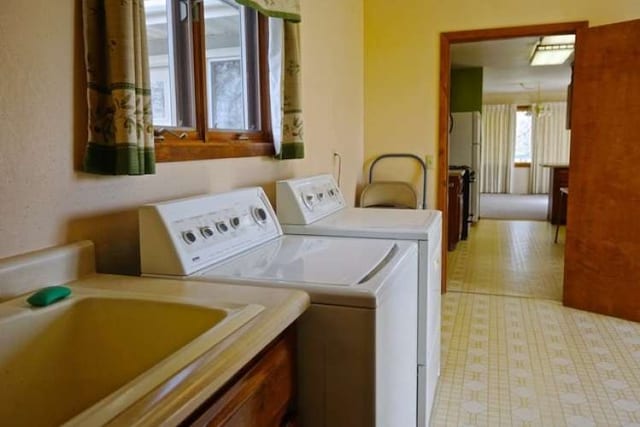 laundry area featuring washer and dryer and sink