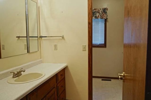 bathroom with tile floors and oversized vanity