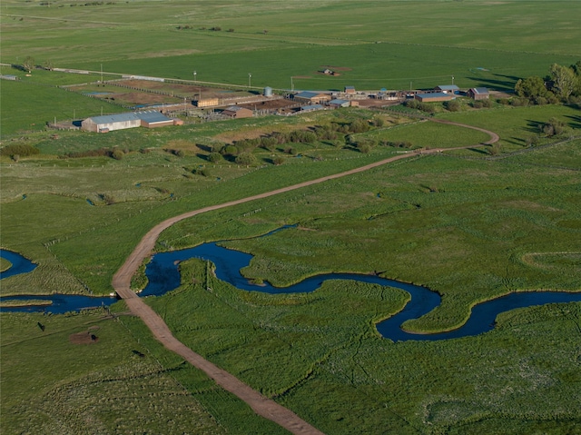 drone / aerial view with a rural view and a water view