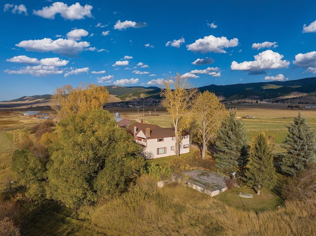 birds eye view of property featuring a mountain view