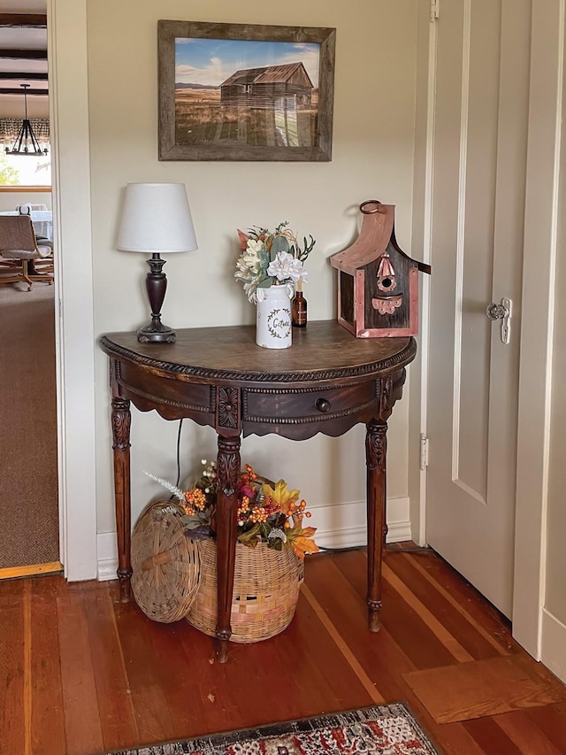 room details featuring baseboards and wood finished floors