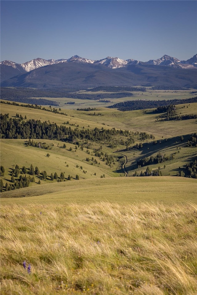 property view of mountains featuring a rural view