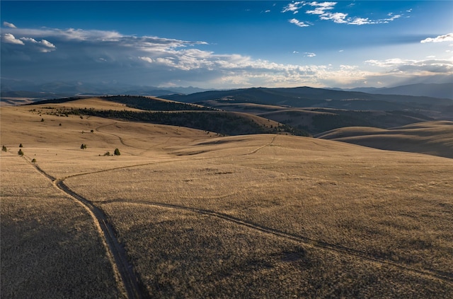 property view of mountains featuring a rural view