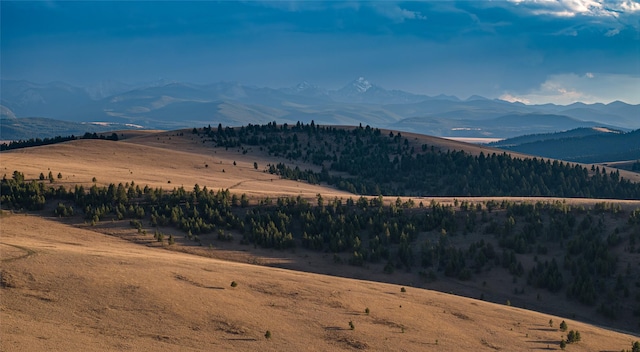 property view of mountains featuring a rural view