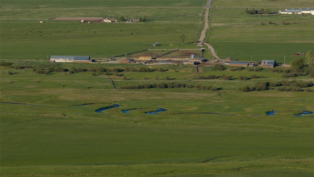 birds eye view of property featuring a rural view